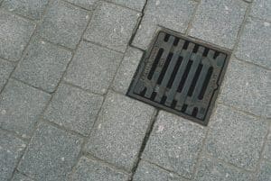sewer drain in road